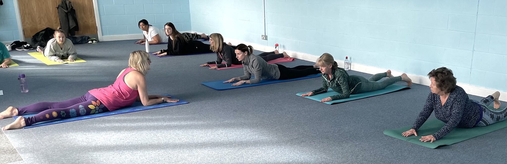 Dru yoga class stretching back